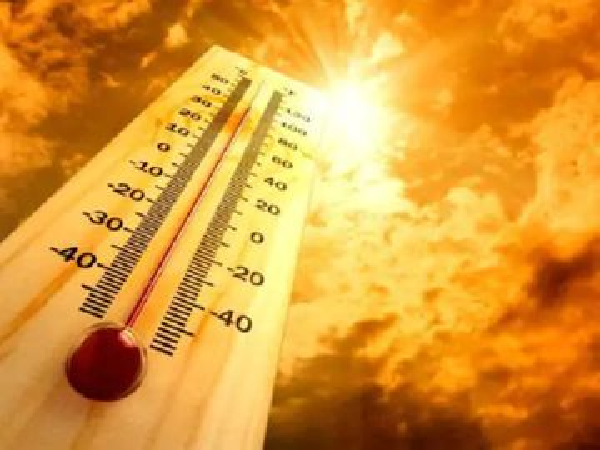 Thermometer against a sunny sky
